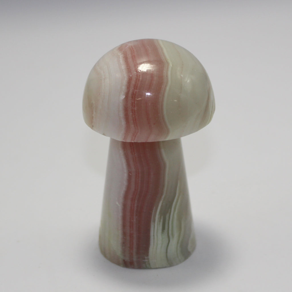 Pink calcite mushroom